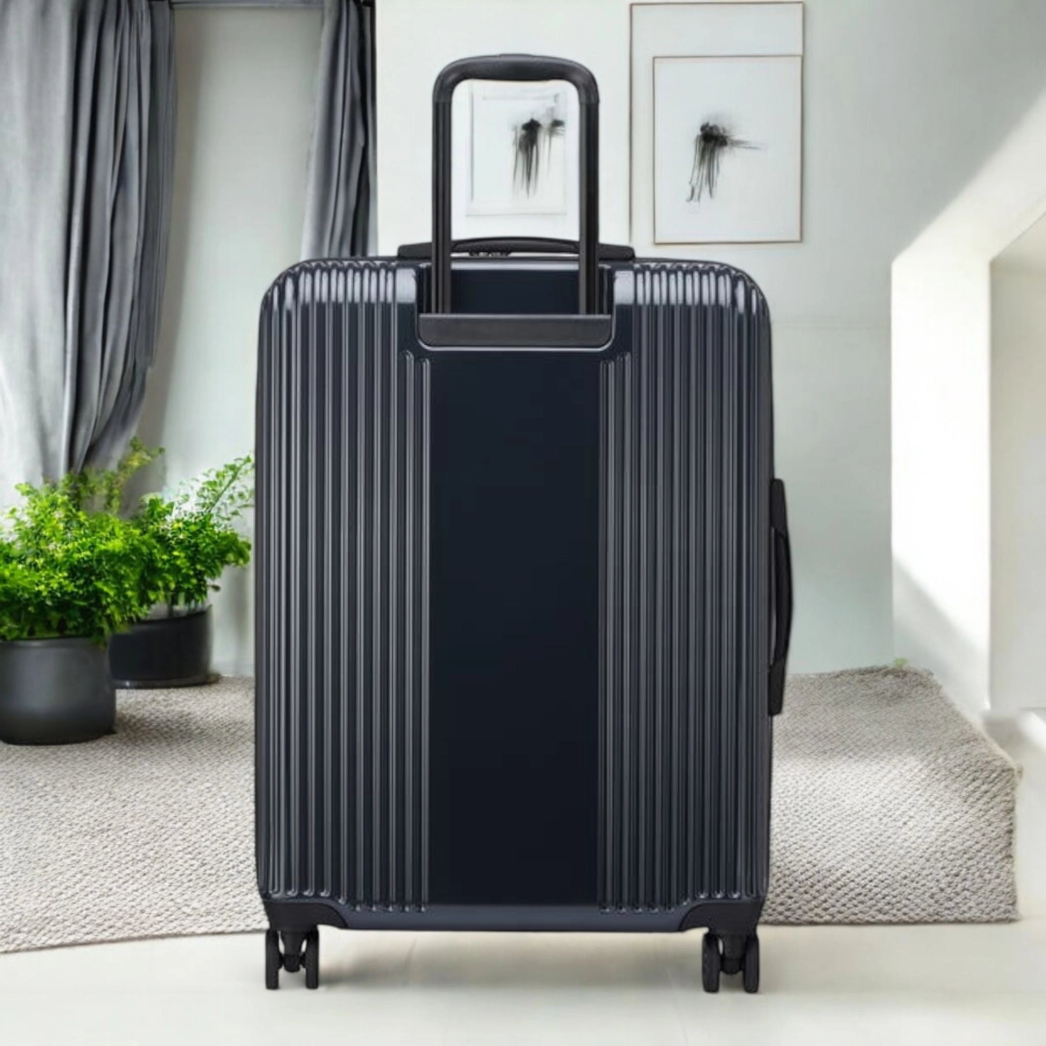 Delsey Ophelia luggage bag in black with ribbed design and retractable handle for stylish travel