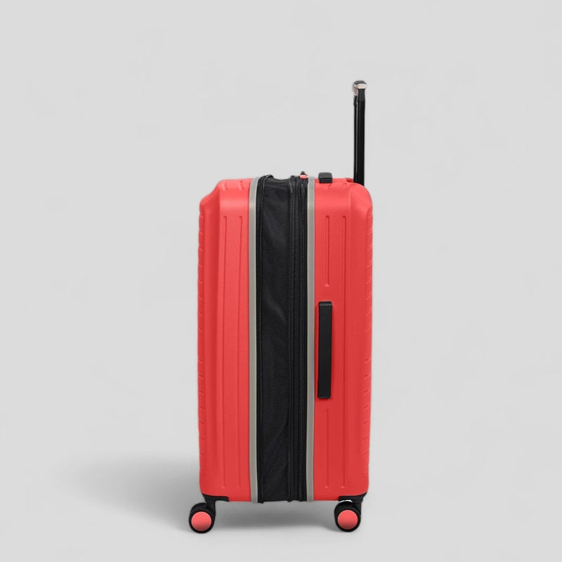 Haris eco-friendly luggage set in bright red, featuring durable wheels and a sleek design