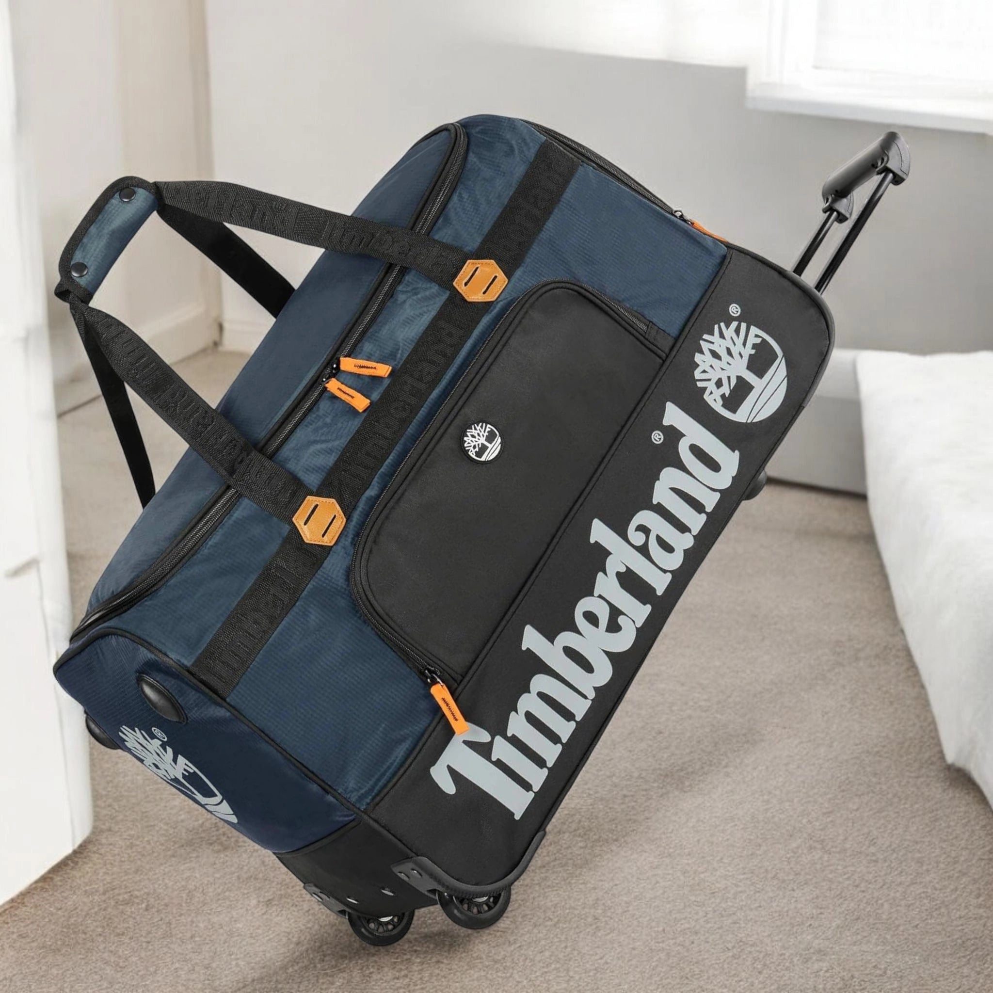 Blue and black Timberland duffel bag with wheels in pakistan
