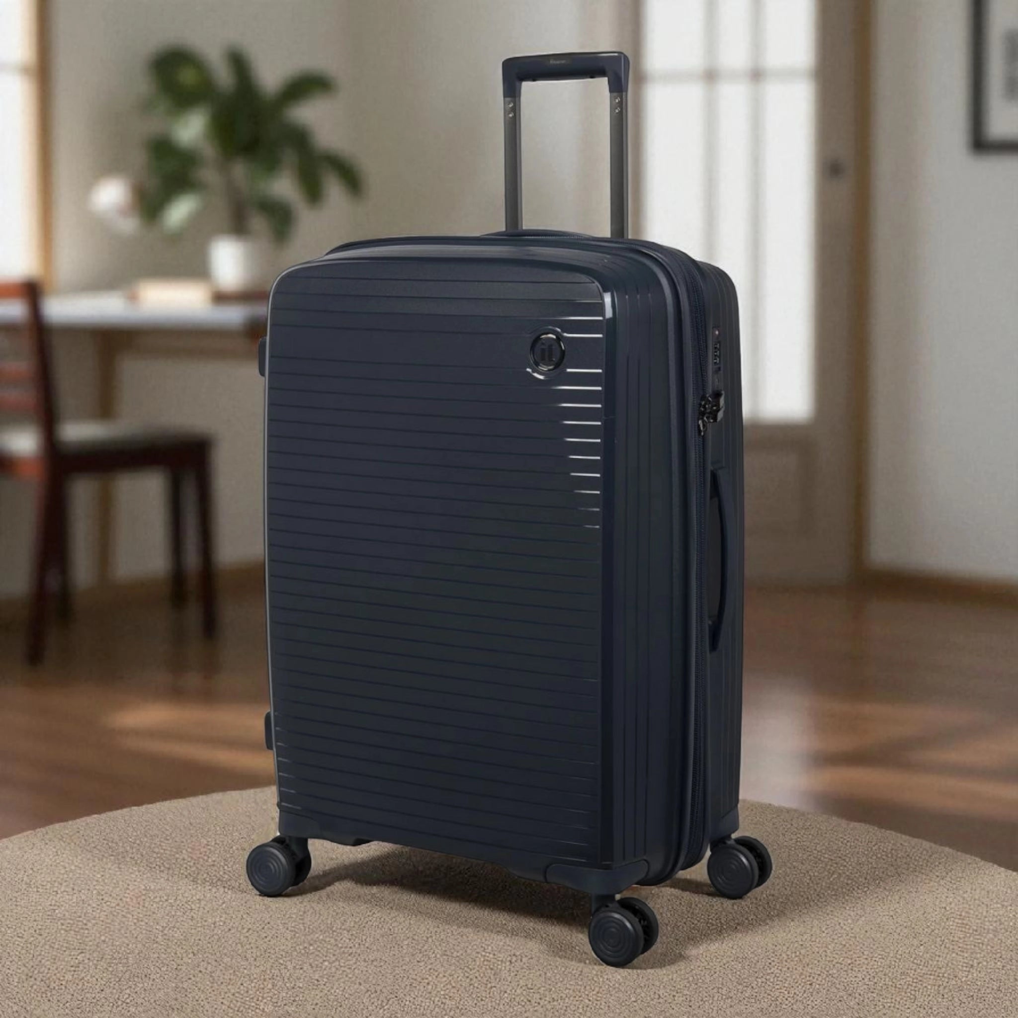 Haris Luggage TSA approved 360 spinner suitcase in navy blue with multi-directional wheels