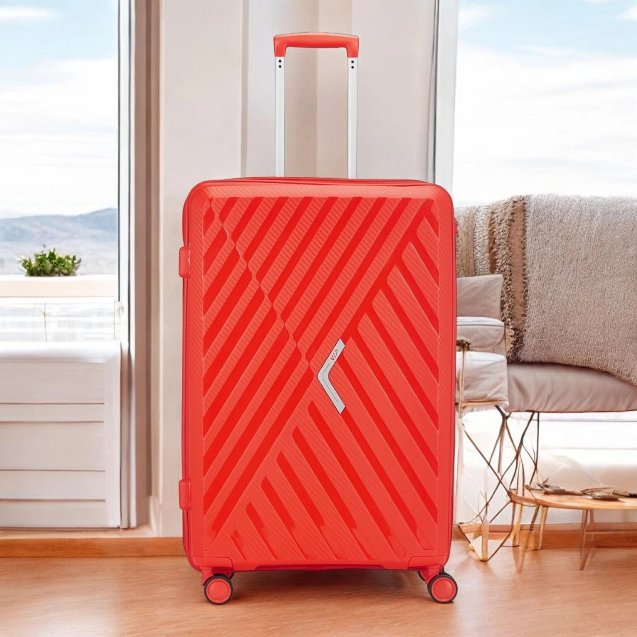 Bright red VIP Xlite PP luggage Pakistan with durable design and smooth-rolling wheels