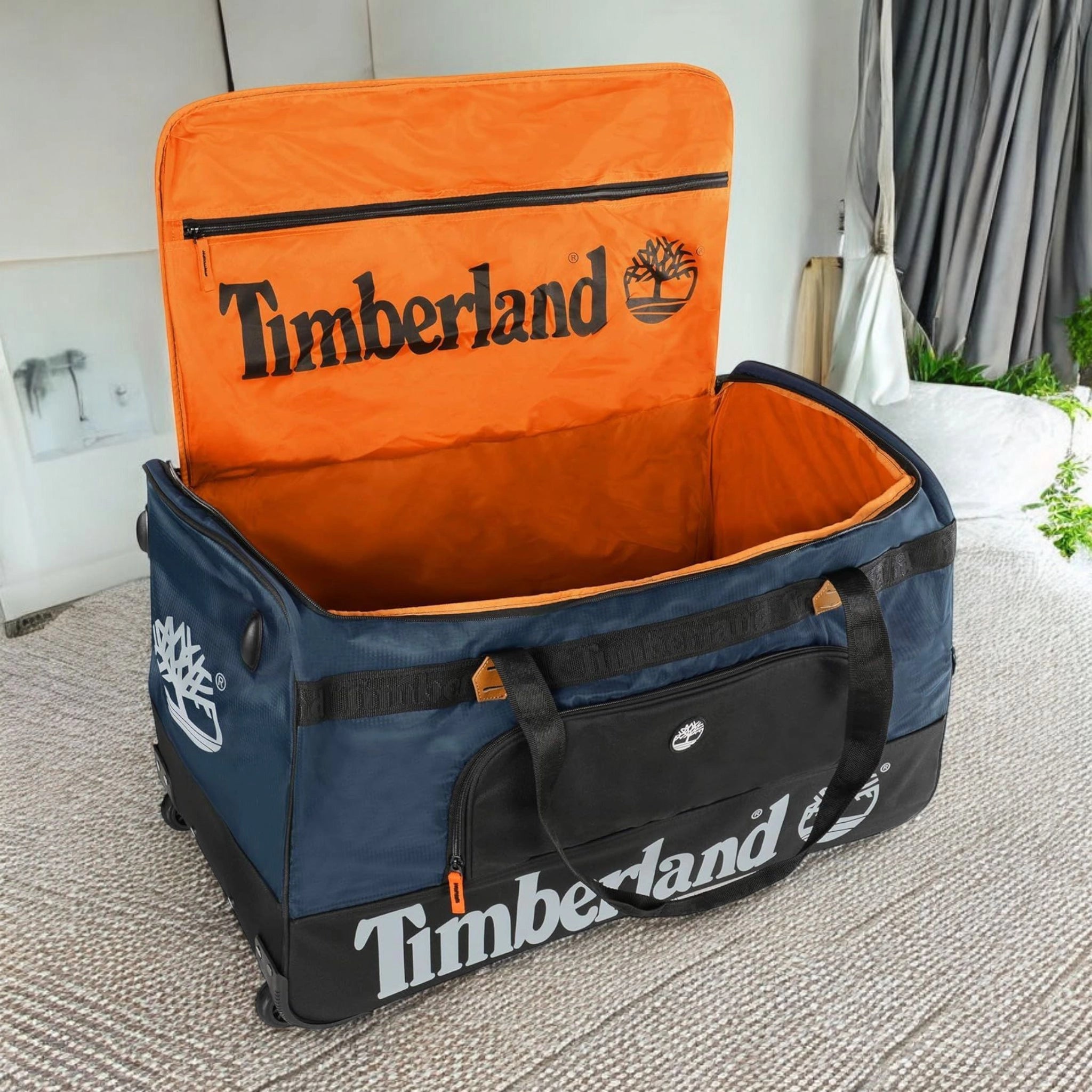 Blue and orange Timberland suitcase bag