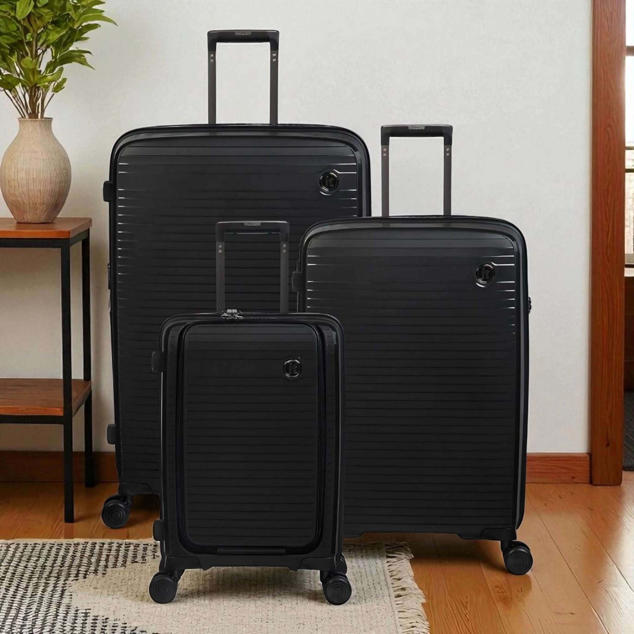 Set of three black Haris Luggage TSA approved 360 spinner suitcase with smooth wheels and durable design